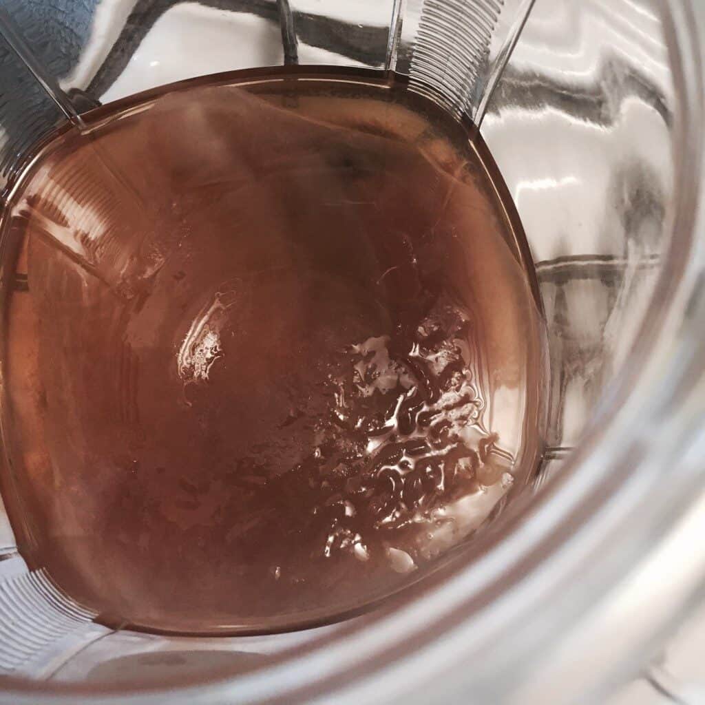 aerial view of a scoby growing inside of homemade kombucha