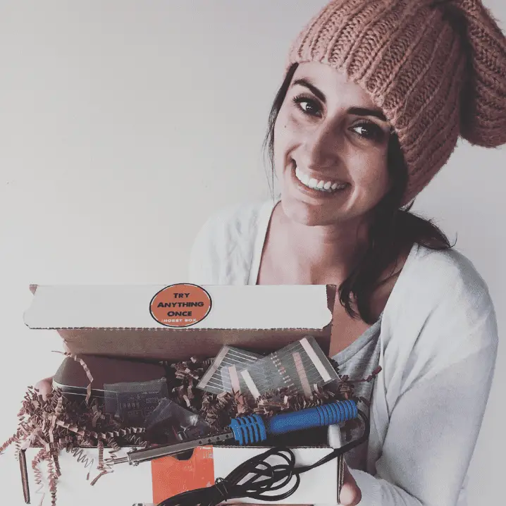 woman holding new hobby box electronics kit